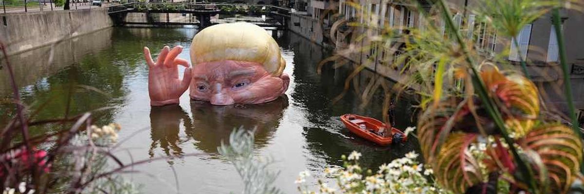 Everything Is [Not] Fine: Half-Submerged Trump Head, Says Artist, Designed to Silence Destructive Words and Deeds of US President