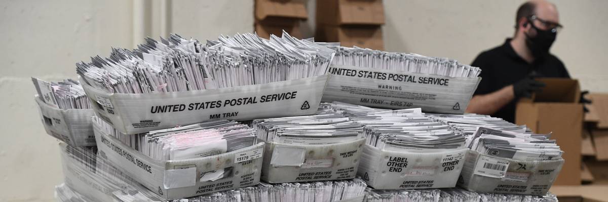 a pile of mailed ballots