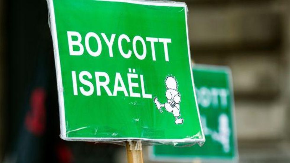 A placard at a pro-Palestinian protest in Paris on May 12th, 2018: the EU imports goods from Israeli settlements at an estimated annual value of $300 million. Photograph: Etienne Laurent