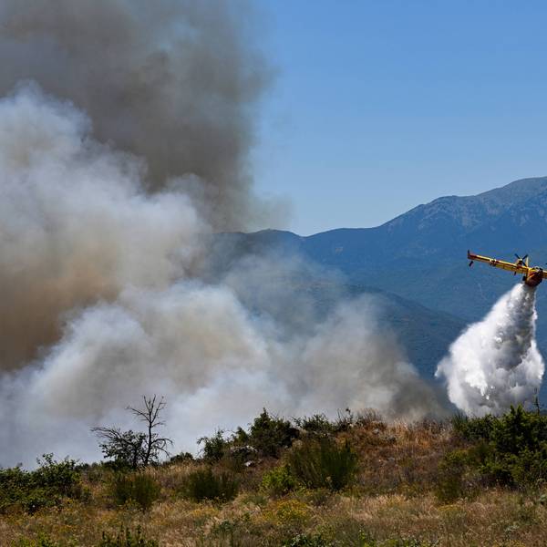 A plane fights a wildfire in France.