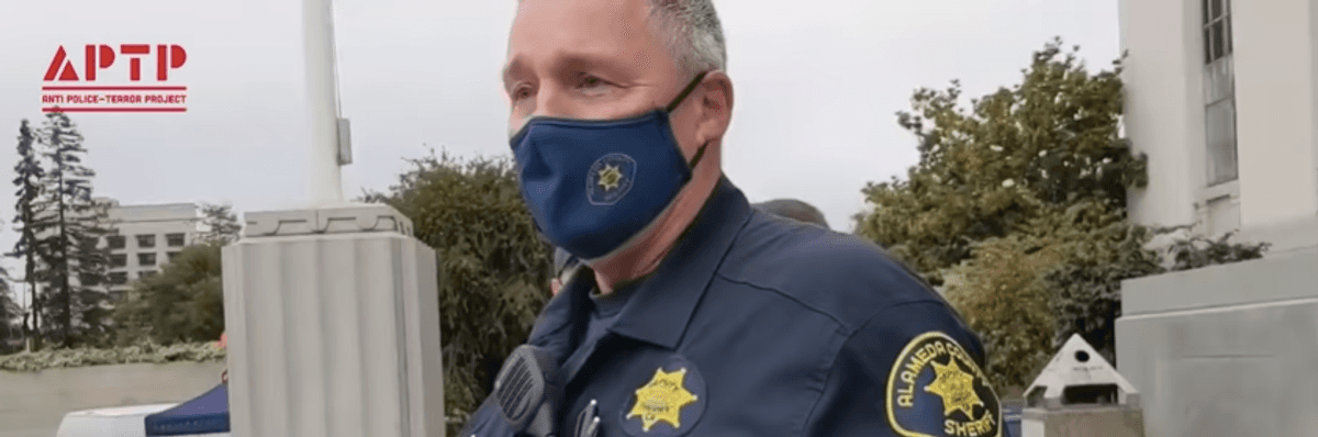 A police officer attempted to stop activists from uploading a video of him at a Black Lives Matter rally.