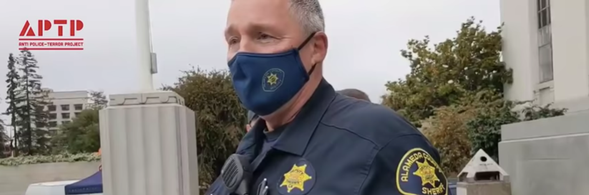 A police officer attempted to stop activists from uploading a video of him at a Black Lives Matter rally.