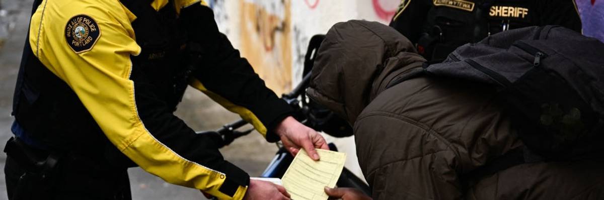 A Portland police officer issues a citation for drug possession