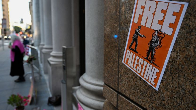 A poster shows Aaron Bushnell's last moments with the words Free Palestine.