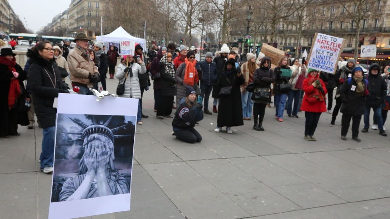 A poster with an image of the face of the Statue of Liberty