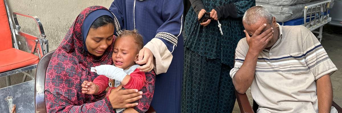A pregnant woman mourns her husband's death in an Israeli attack in Rafah, Gaza