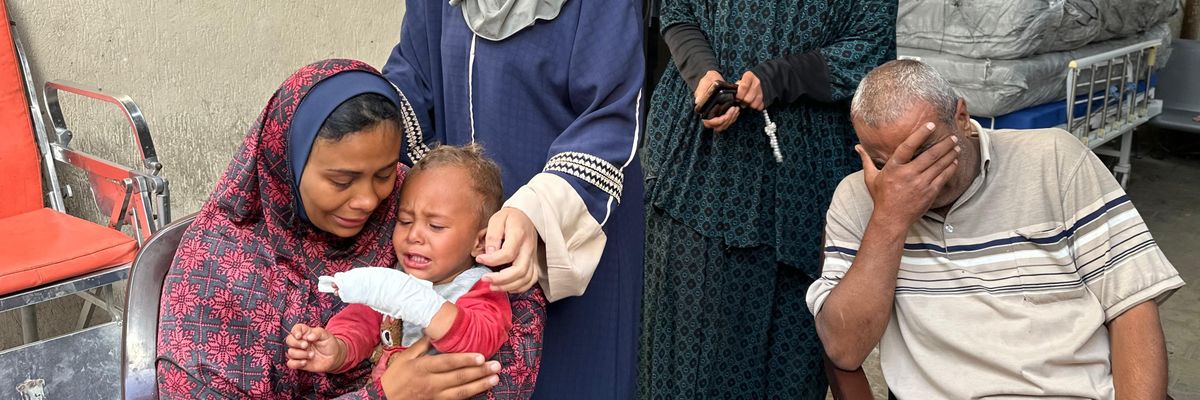A pregnant woman mourns her husband's death in an Israeli attack in Rafah, Gaza
