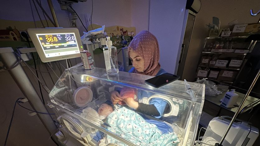 A premature baby lies in an incubator at Al-Aqsa Martyrs Hospital 