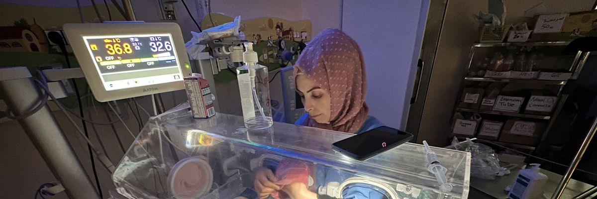 A premature baby lies in an incubator at Al-Aqsa Martyrs Hospital