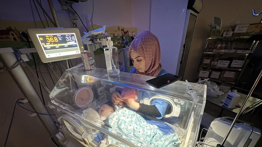 A premature baby lies in an incubator at Al-Aqsa Martyrs Hospital