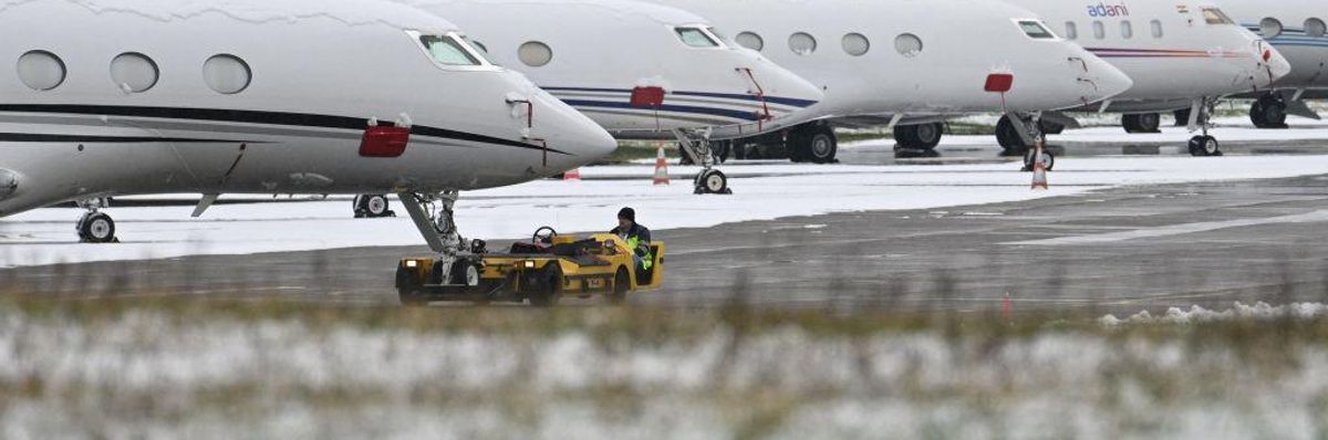 A private jet is moved by a technician at the Dubendorf airport, on January 18, 2023