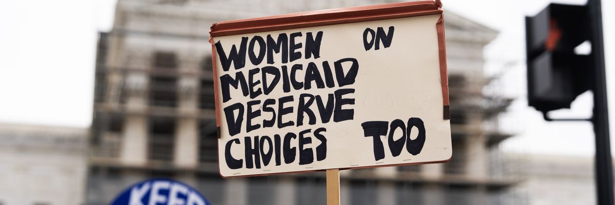 A pro-choice demonstrator holds a sign