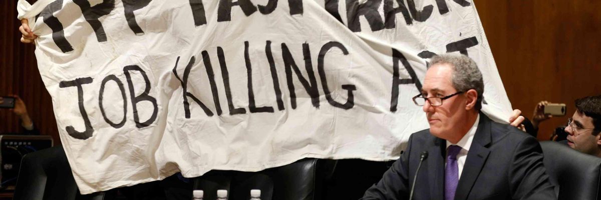 A protest against the Trans-Pacific Partnership agreement aimed at the U.S. Trade Representative Michael Froman