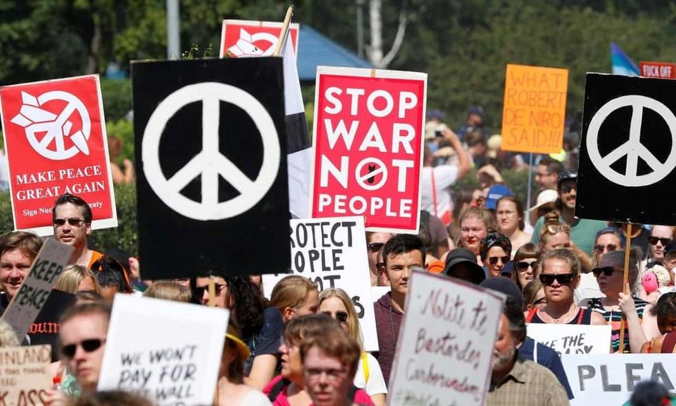 A protest in Helsinki ahead of the summit meeting. (Photograph: Leonhard Foeger/Reuters)