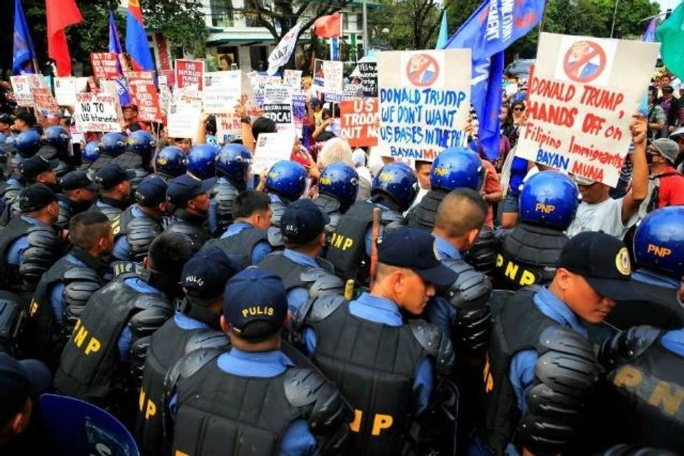 A protest in Manila, Philippines, was met with a strong police response. (Photo: Reuters)