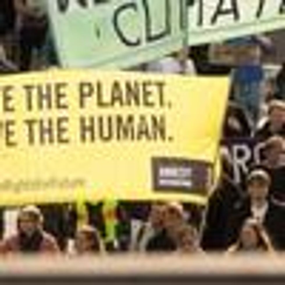 A protest sign reads