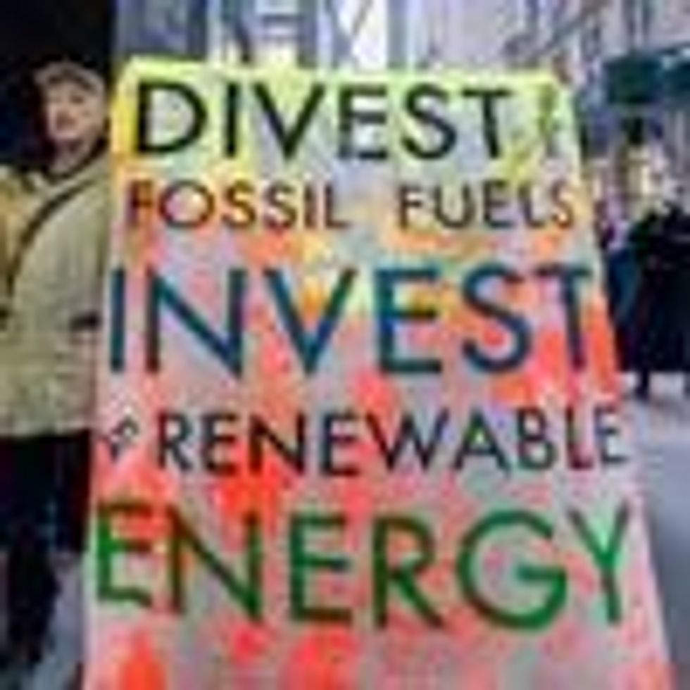 A protester holds a banner at the rally outside JP Morgan Headquarters in Manhattan, New York. (Photo: Erik McGregor/LightRocket via Getty Images)
