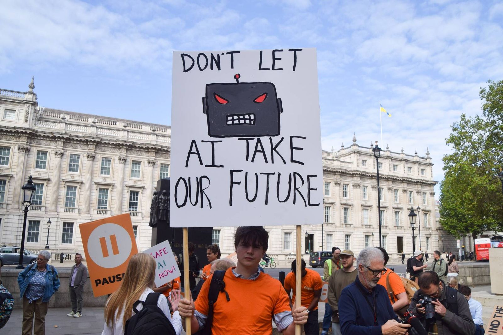 a-protester-holds-a-don-t-let-ai-take-ou