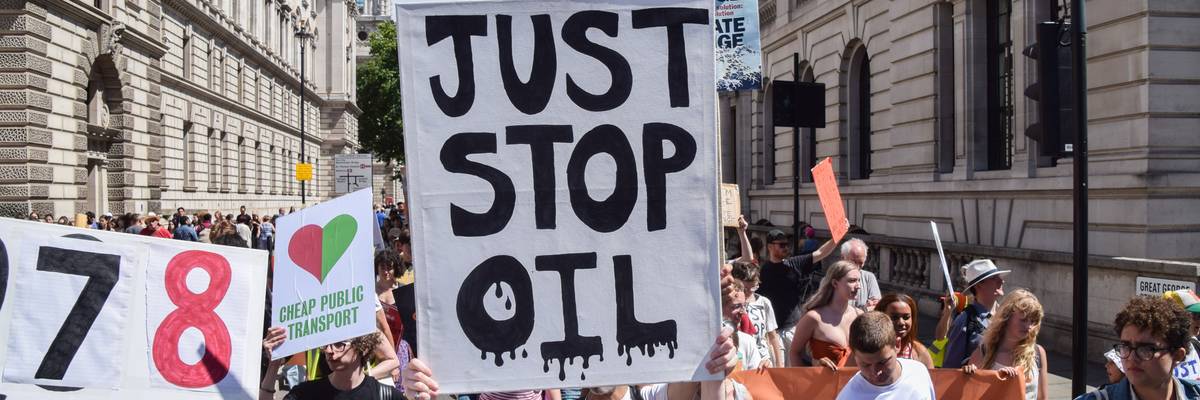 A protester holds a "Just Stop Oil" placard in London.