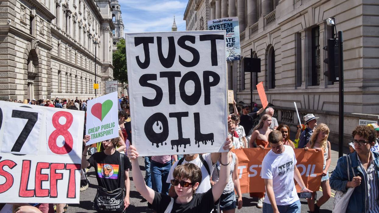 A protester holds a "Just Stop Oil" placard in London.