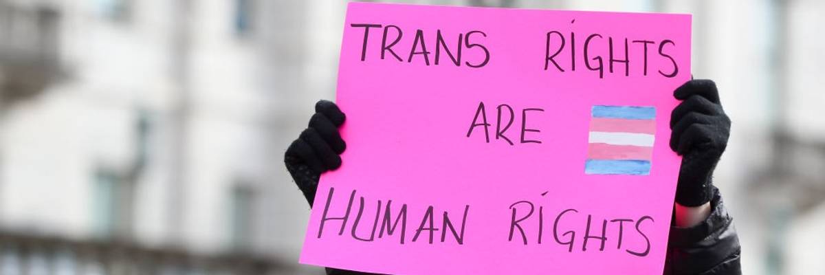 A protester holds a placard outside of the Pennsylvania...