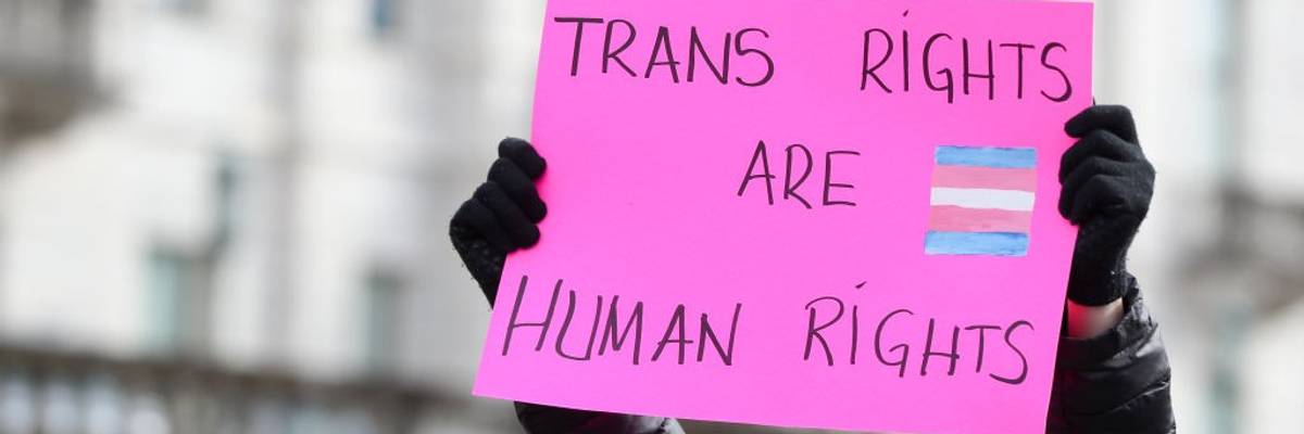 A protester holds a placard outside of the Pennsylvania...