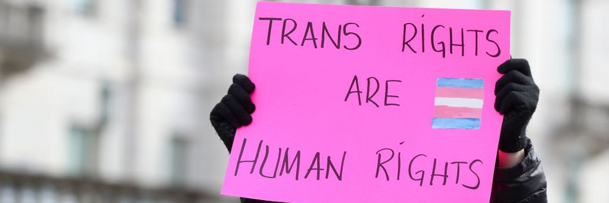 A protester holds a placard outside of the Pennsylvania...