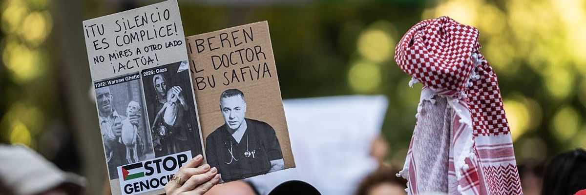 A protester holds a placard