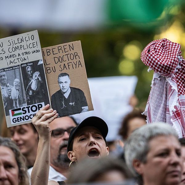 A protester holds a placard
