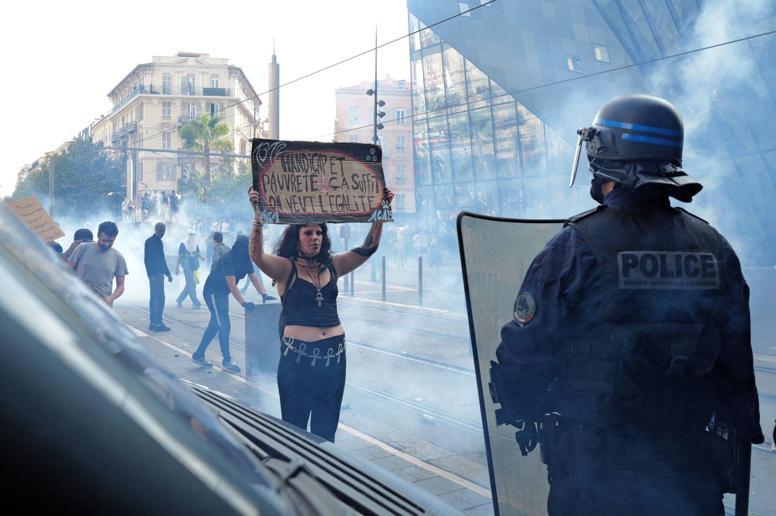 a-protester-holds-a-sign-in-front-of-a-police-officer-in-nice-southern-france-on-october-17-2026.jpg?id=68457352&width=5000&height=3328&coordinates=0%2C0%2C0%2C0