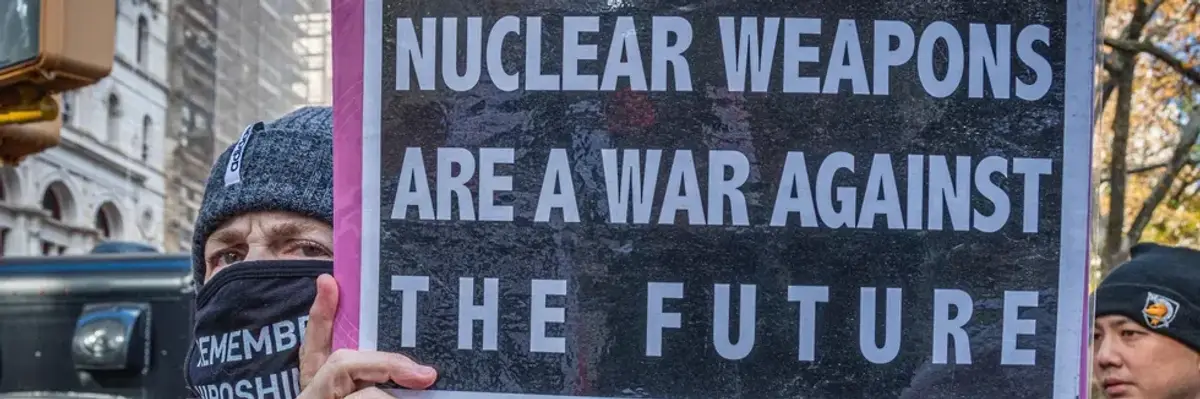 A protester holds a sign reading, "Nuclear weapons are a war against the future" at a demonstration in New York City on November 23, 2021.