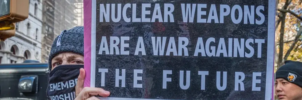 A protester holds a sign reading, "Nuclear weapons are a war against the future" at a demonstration in New York City on November 23, 2021.
