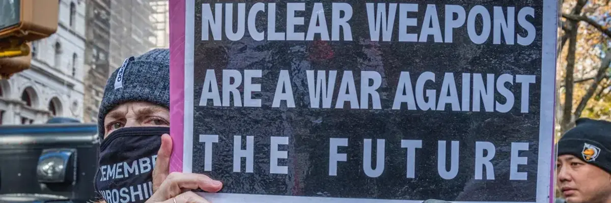 A protester holds a sign reading, "Nuclear weapons are a war against the future" at a demonstration in New York City on November 23, 2021.
