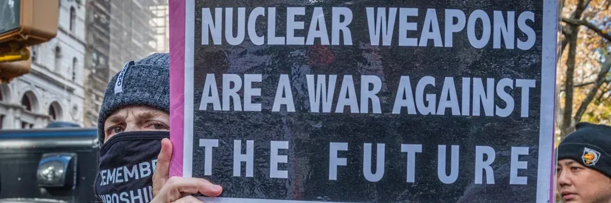 A protester holds a sign reading, "Nuclear weapons are a war against the future" at a demonstration in New York City on November 23, 2021.
