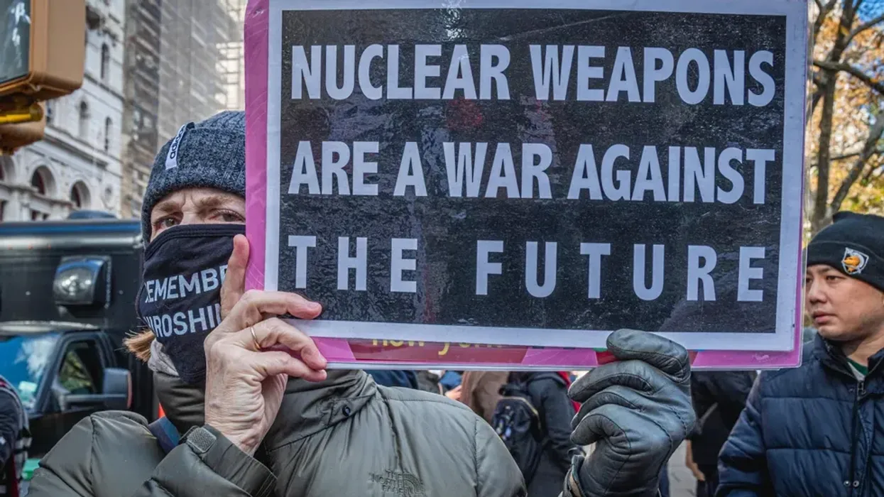 A protester holds a sign reading, "Nuclear weapons are a war against the future" at a demonstration in New York City on November 23, 2021.