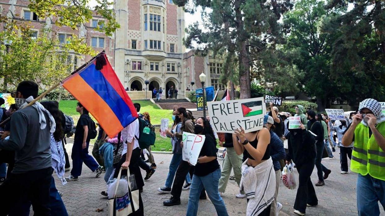 A protester holds an Armenian flag during a Gaza demonstration in LA