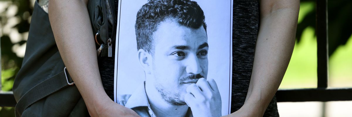 A protester holds an image of Mahmoud Khalil