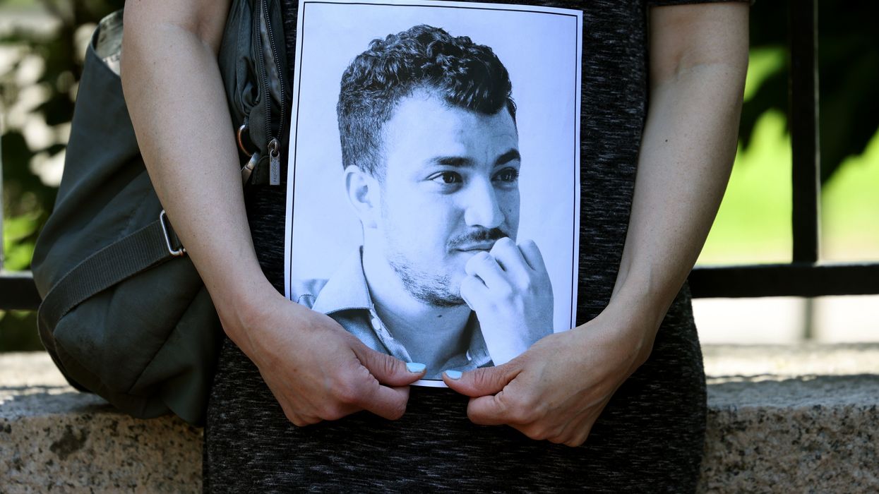 A protester holds an image of Mahmoud Khalil