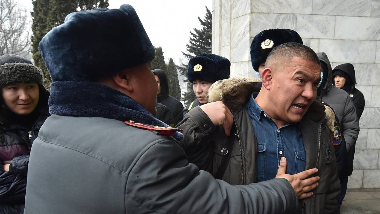 A protester is detained in Kazakhstan