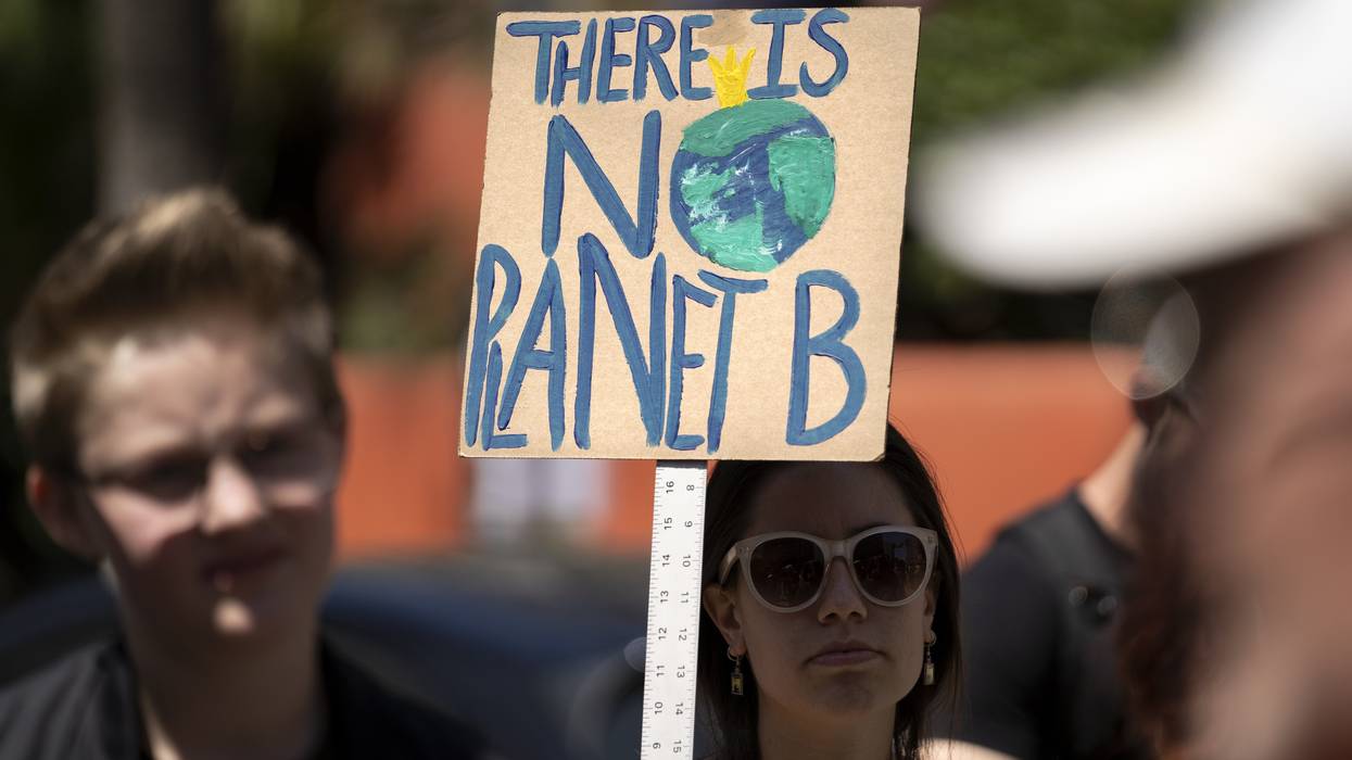 A protester is seen during a climate change demonstration