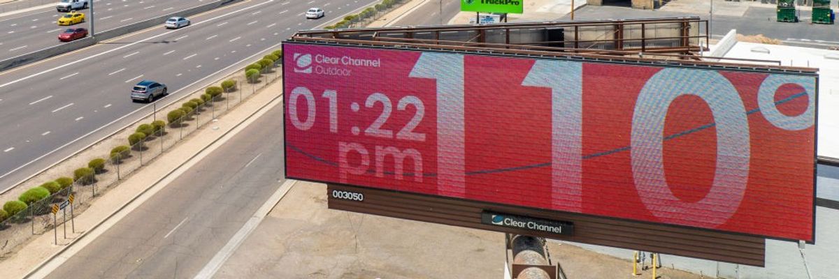 A red billboard reading 110°F.