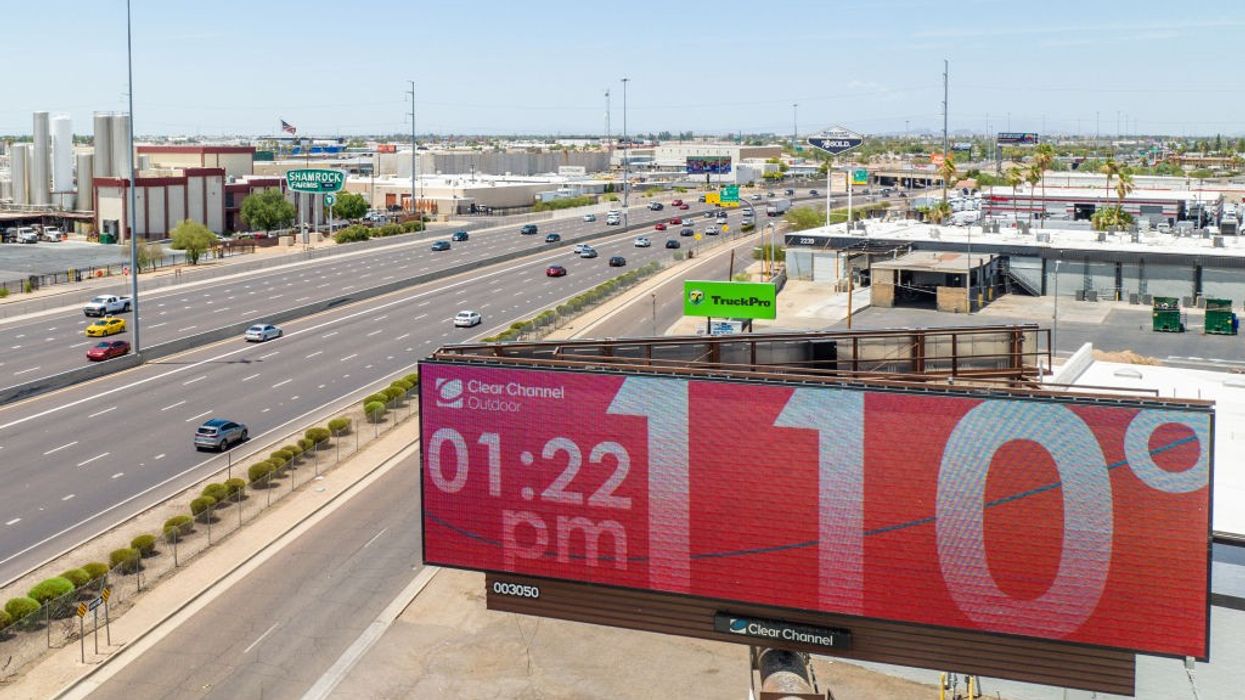 A red billboard reading 110°F.