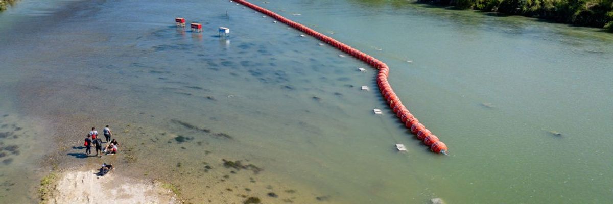 A red buoy barrier in the Rio Grande. 