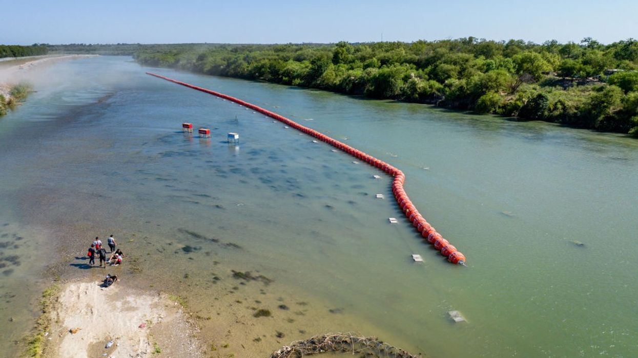 A red buoy barrier in the Rio Grande.