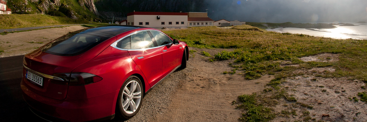A red Tesla is seen parked in Norway