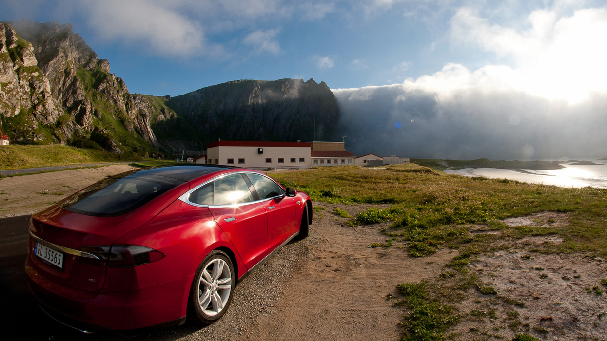 A red Tesla is seen parked in Norway