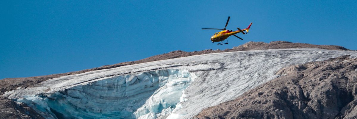 A rescue helicopter over collapsed glacier