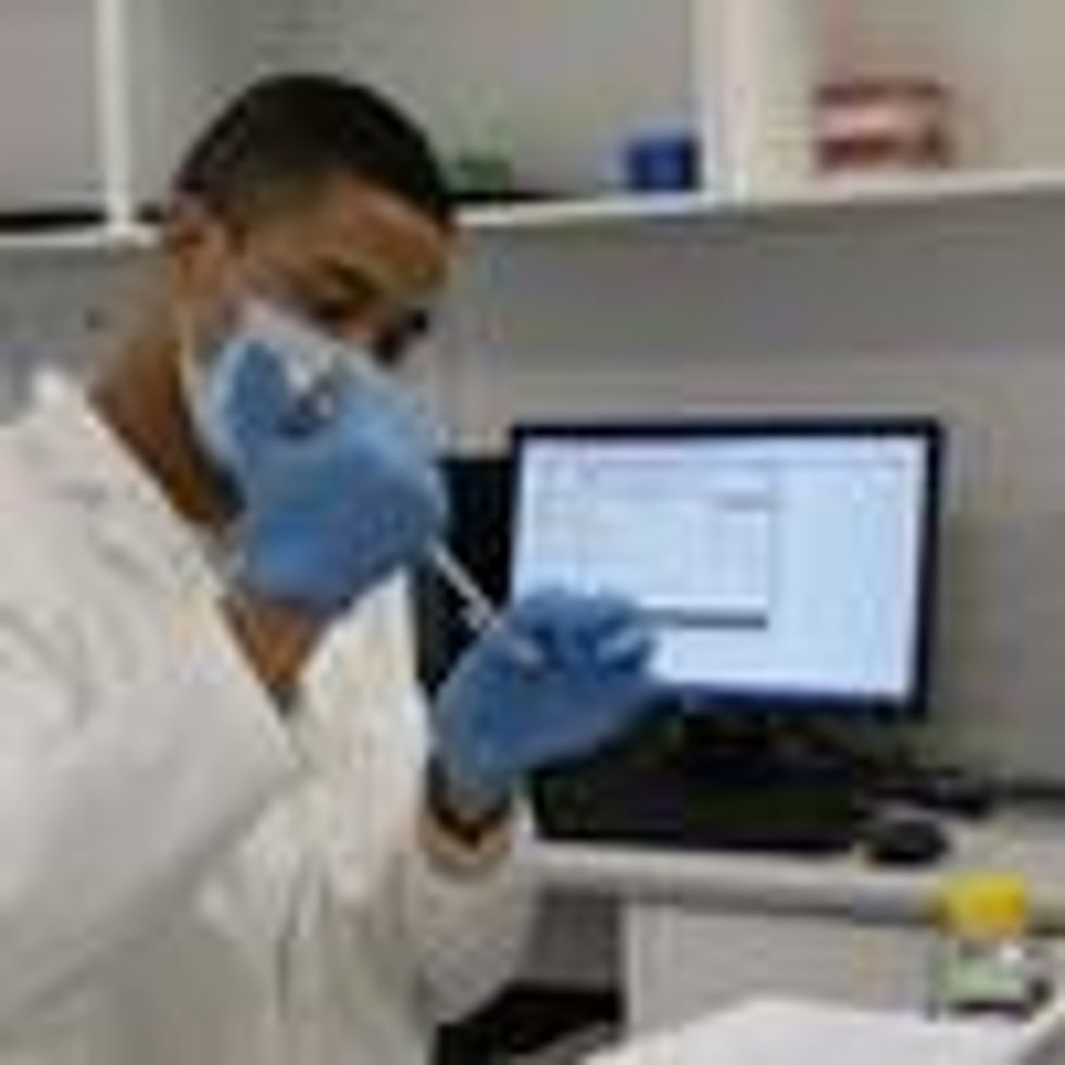 A researcher works in a lab in South Africa