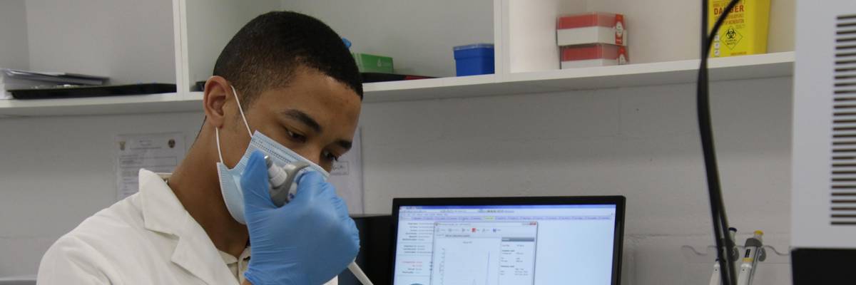 A researcher works in a lab in South Africa