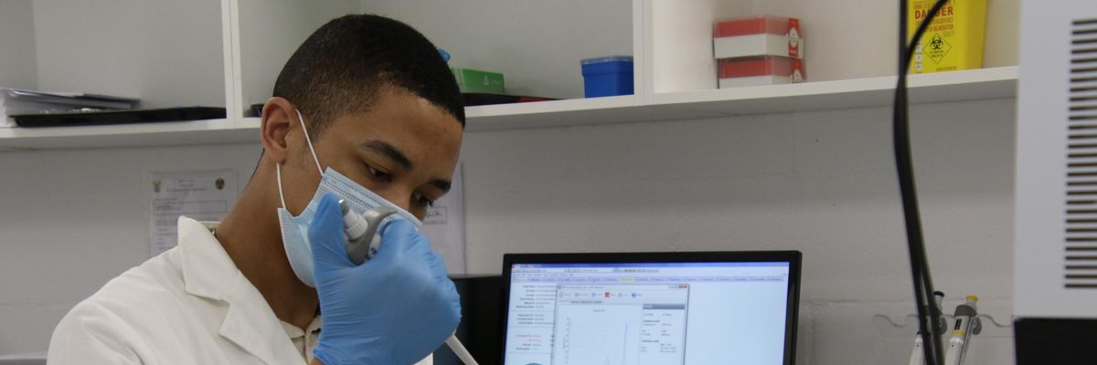 A researcher works in a lab in South Africa